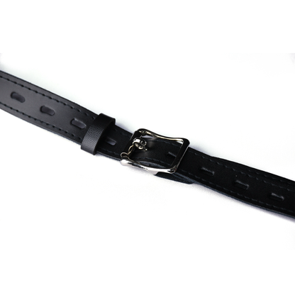 Buckle and adjustment holes on the black PU leather belt